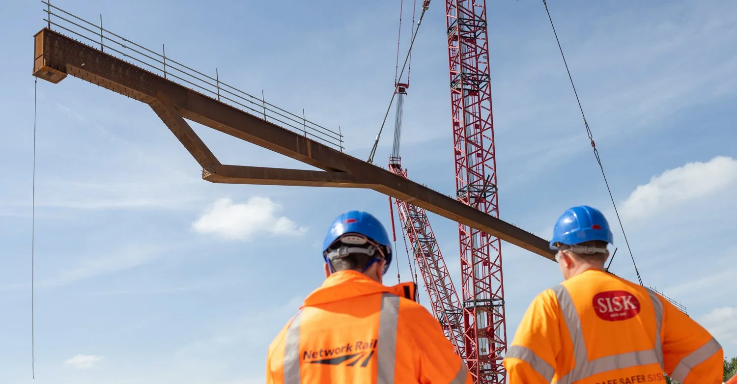 York Central MilestoneSteel beams being lifted into position over East Coast mainline railway at York CentralImage caption - Chris Winter | SISK 
