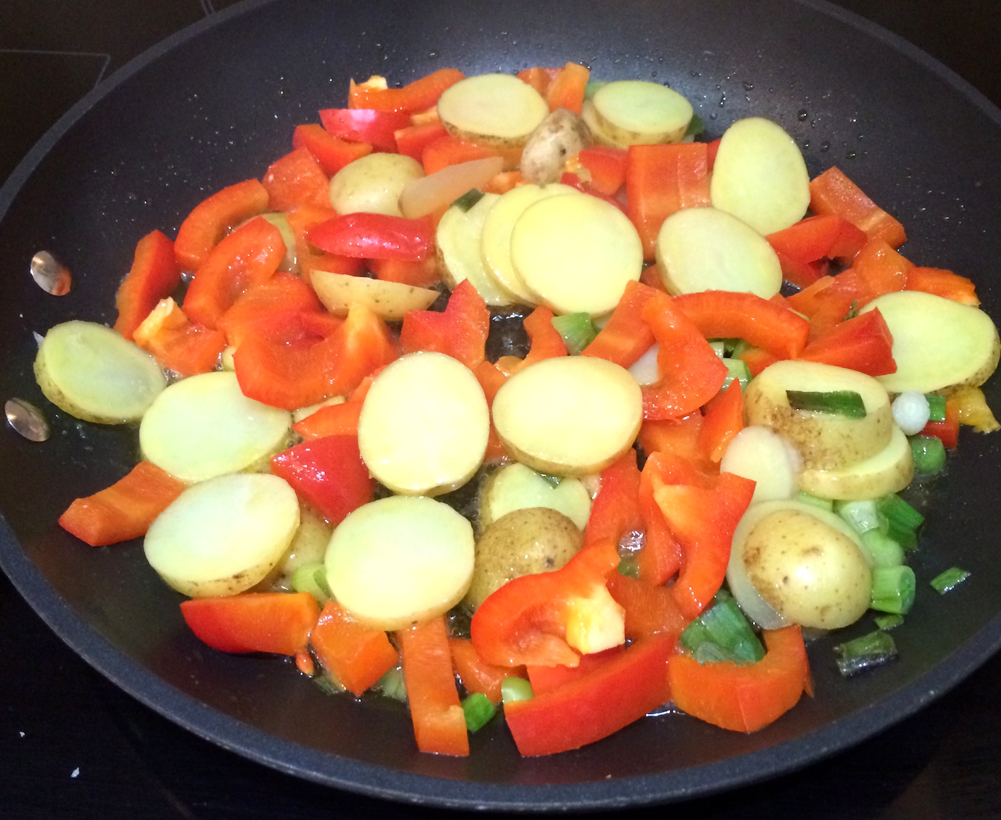Potatoes, Peppers cooking