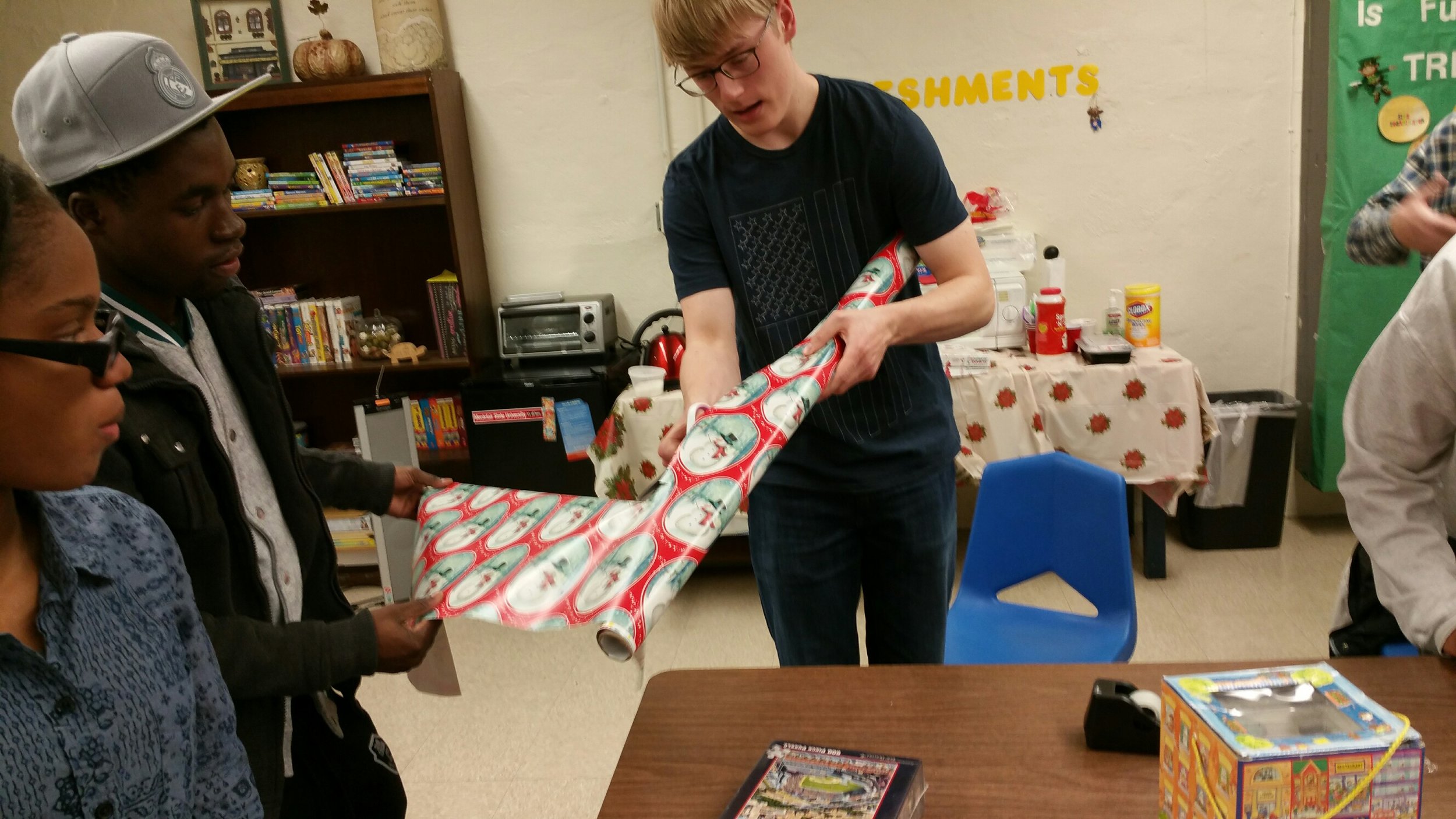 NJIT Volunteers help FARC wrap Holiday gifts for fire victims and special needs kids.