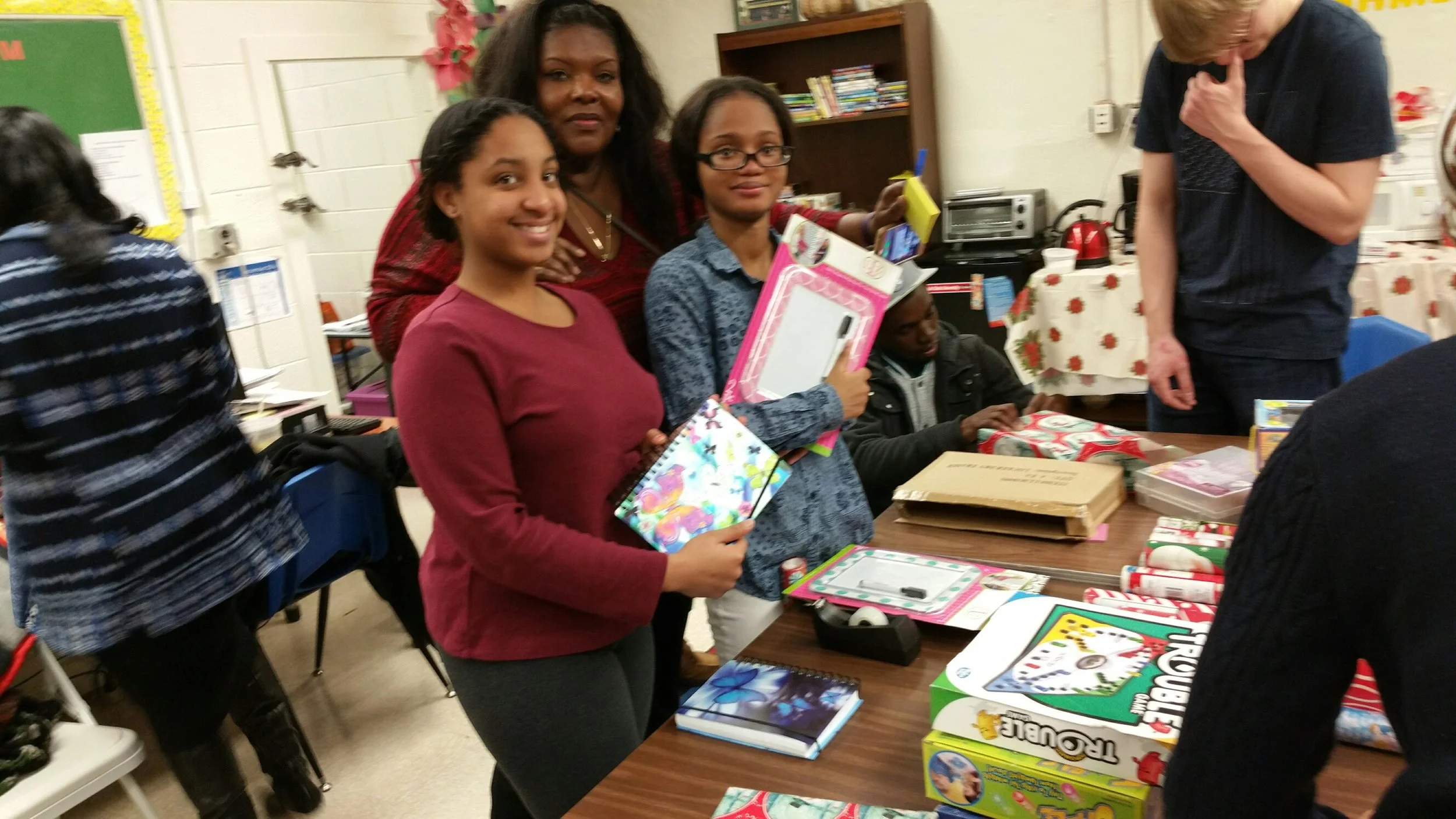 NJIT Volunteers help FARC wrap Holiday gifts for fire victims and special needs kids.