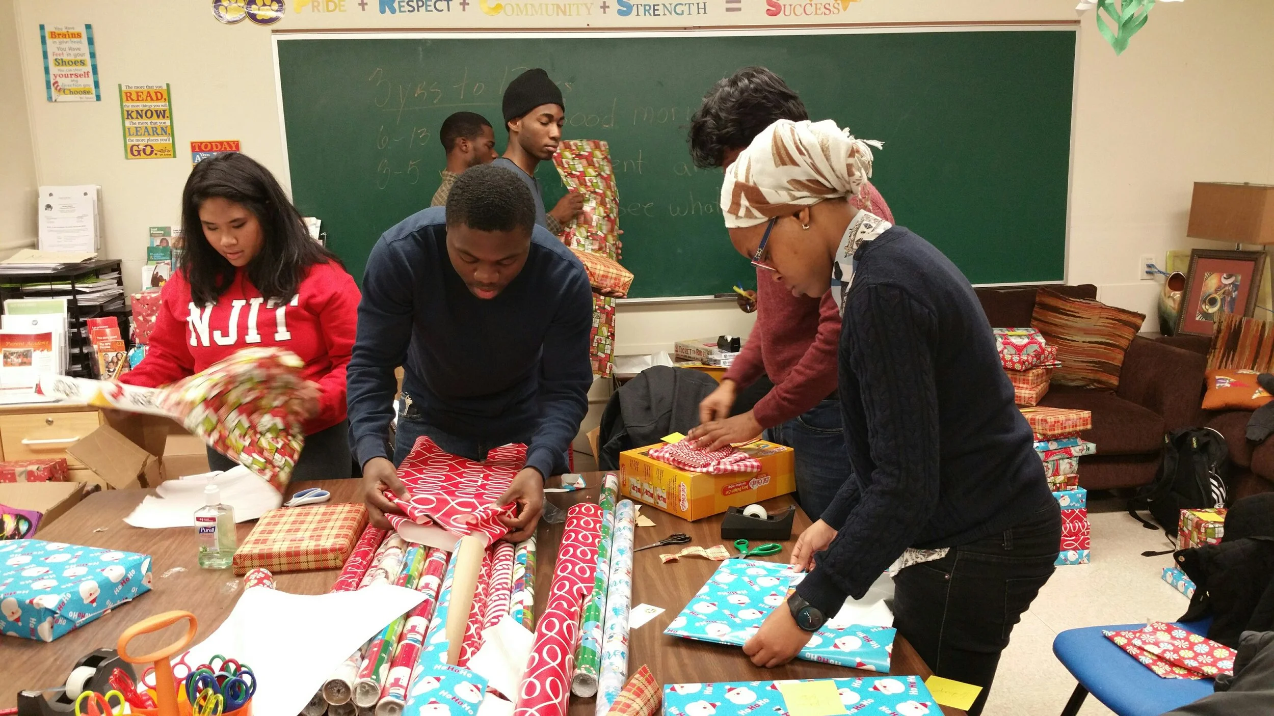 NJIT Volunteers help FARC wrap Holiday gifts for fire victims and special needs kids.