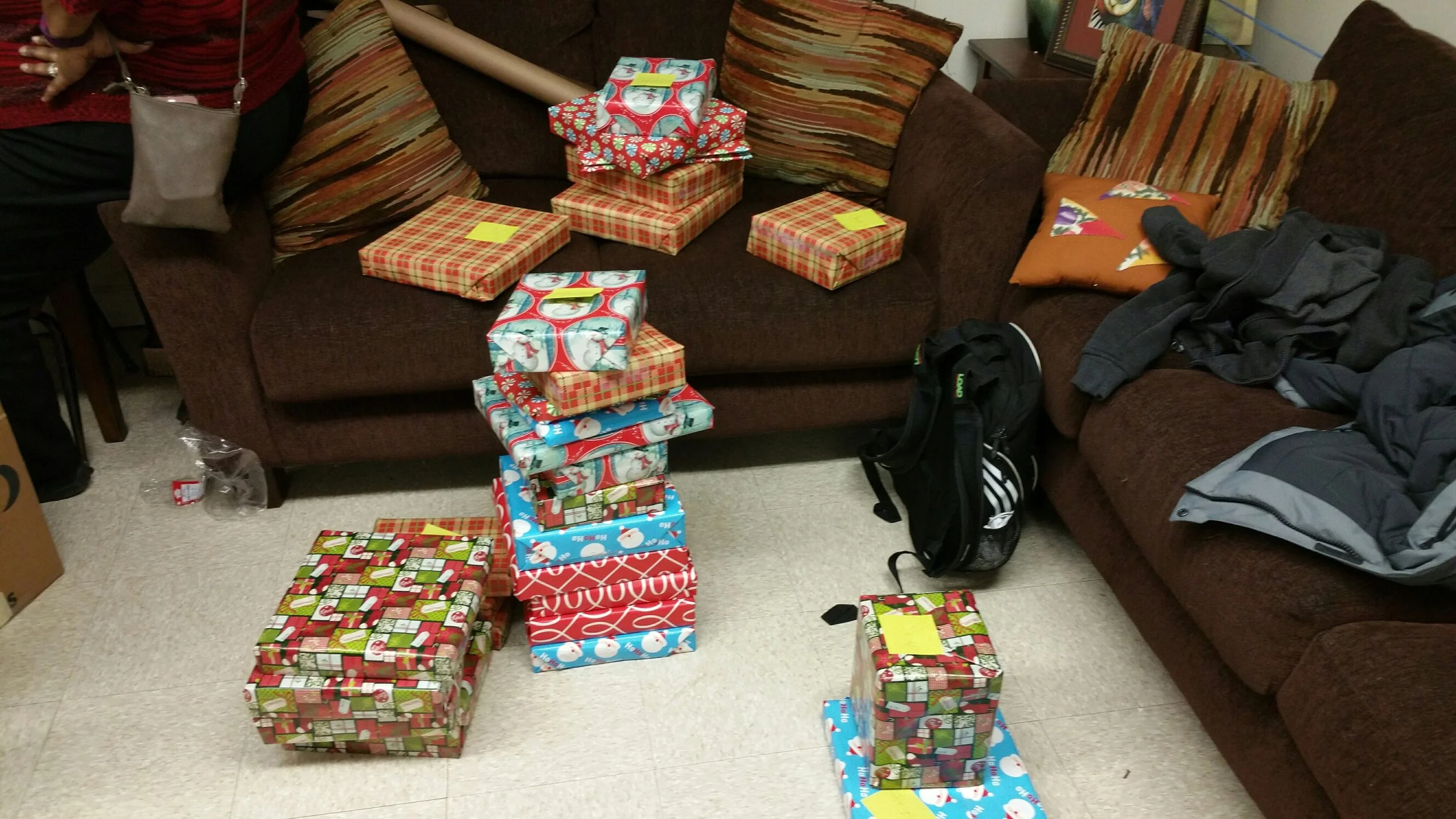 NJIT Volunteers help FARC wrap Holiday gifts for fire victims and special needs kids.