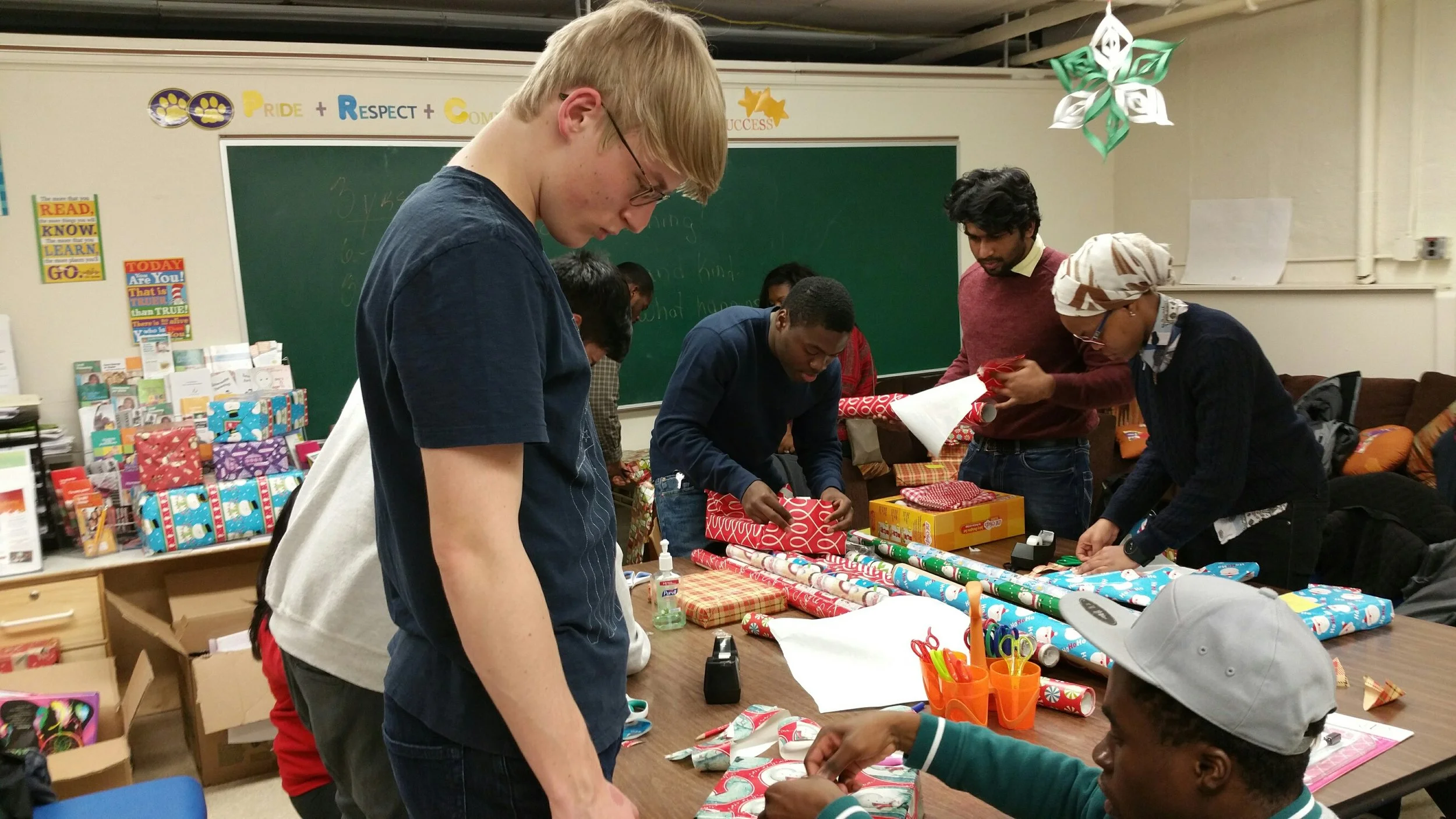 NJIT Volunteers help FARC wrap Holiday gifts for fire victims and special needs kids.