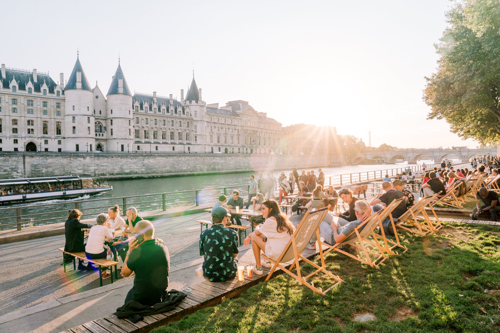  Paris street scene: People enjoying after work drinks or workouts by the Seine 