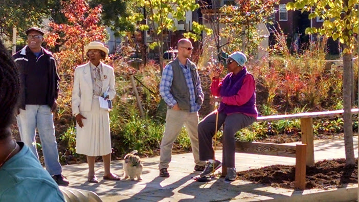 2014 Whitelock Harvest Fest participants in front of the hill on the South Lots. The hill is a burst of bold autumn color.