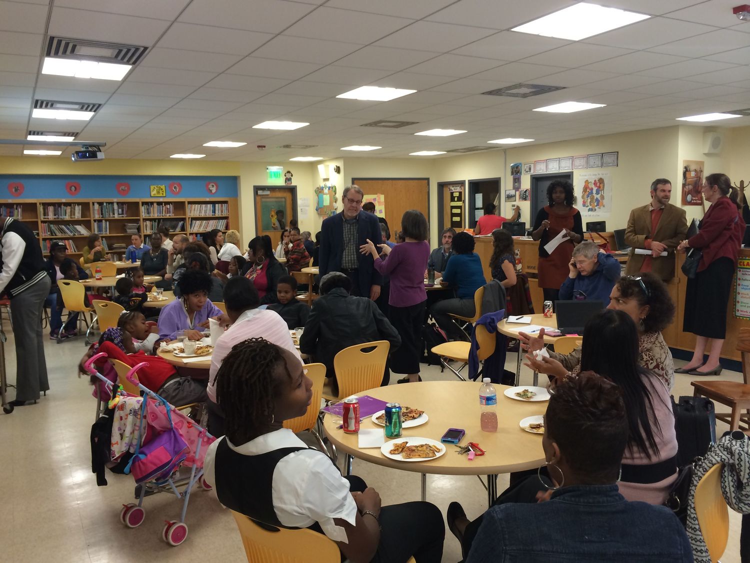 Parents and other community members discussing the design for the redeveloped John Eager Howard School