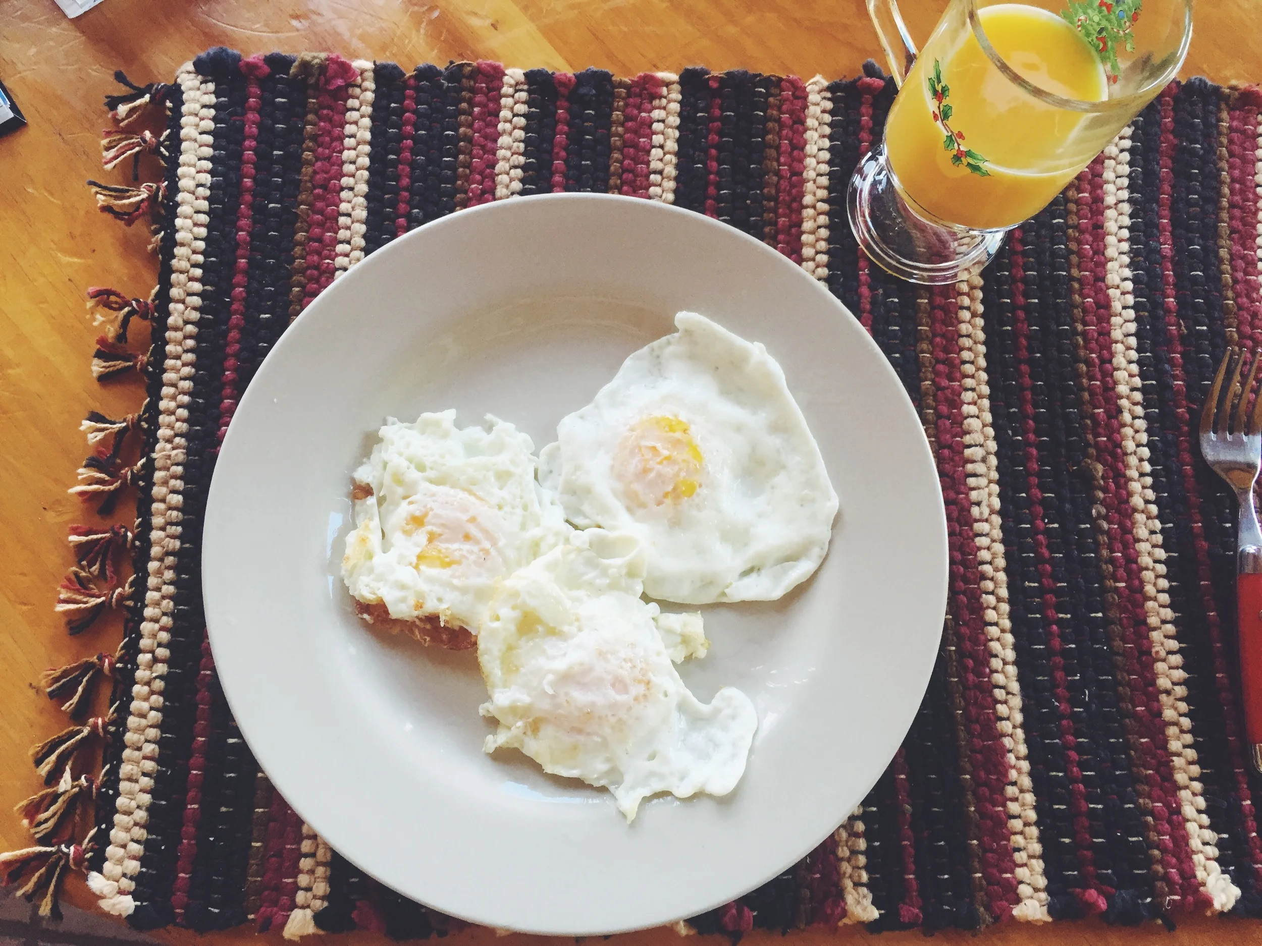 Working on perfecting my fried eggs...also its never too early for a Christmas glass