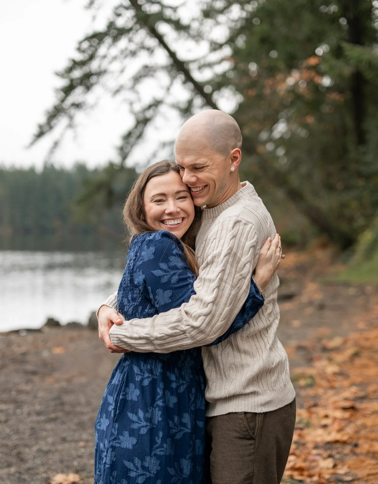 Candid portrait of a couple embracing during a fall family photo session in Olympia, Washington.