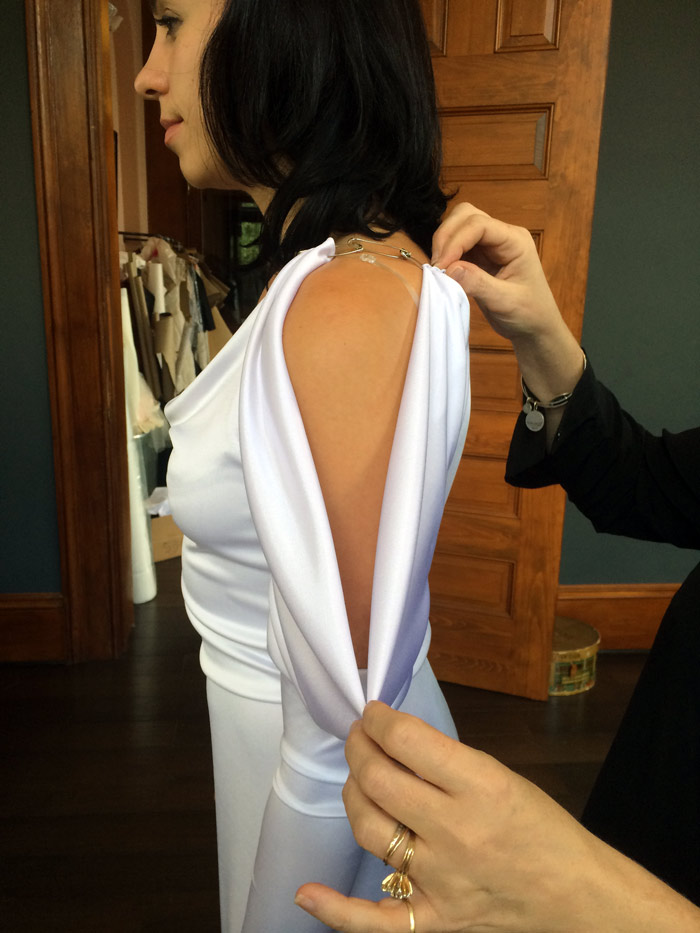 Jill adjusts the drape of this elegant sleeve so that's it's just right.