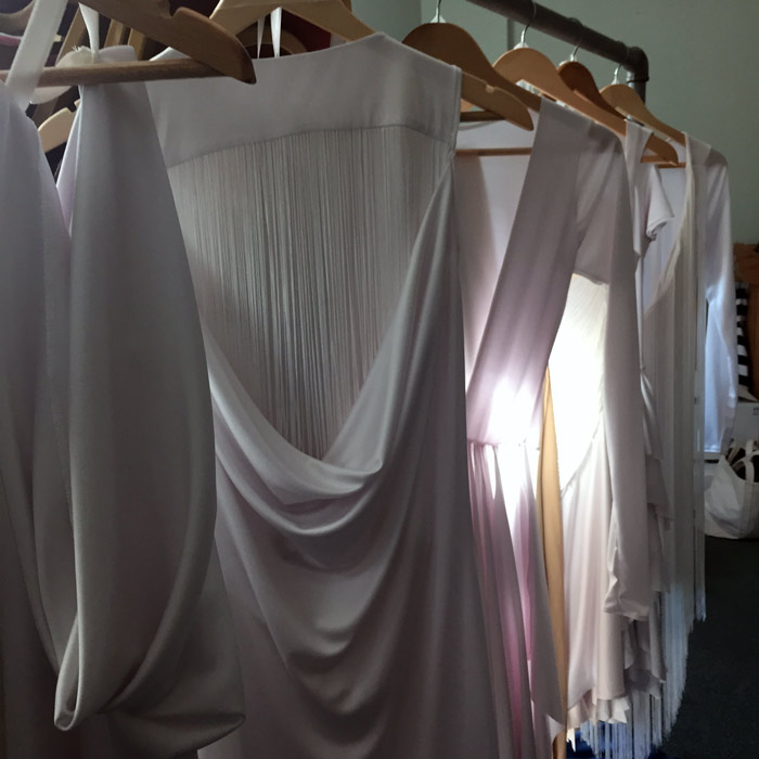 After a week of designing and bringing these dresses to life, it was so satisfying to see them all hung up together in our dressing room.