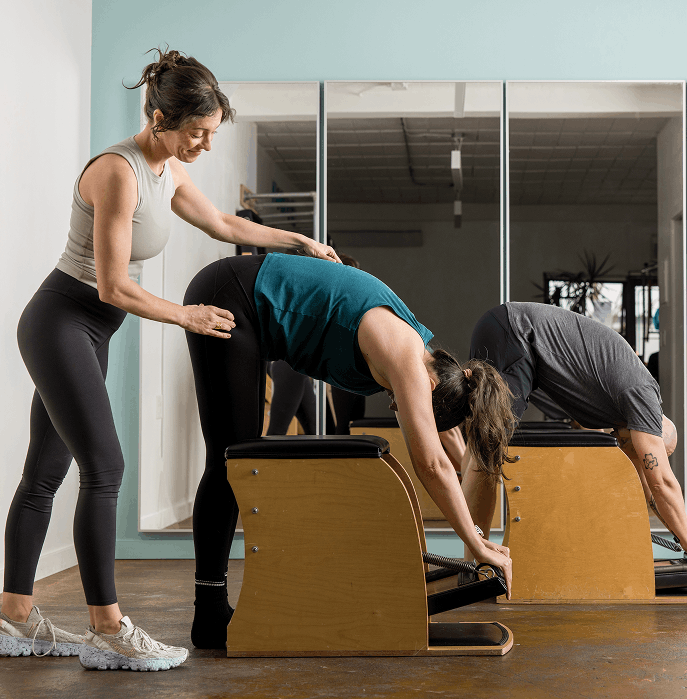 a woman teaching a group pilates class in seattle eastlake at union pilates