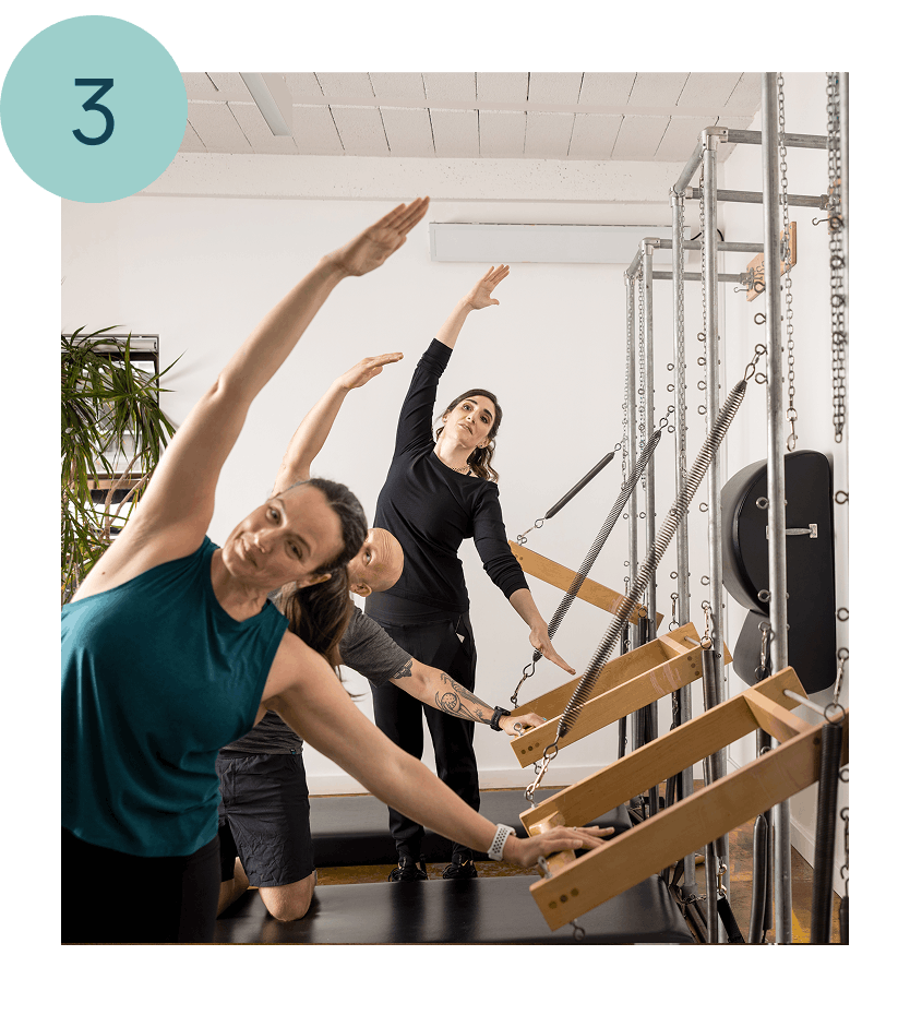 people in a pilates class for core recovery after birth in seattle at union pilates