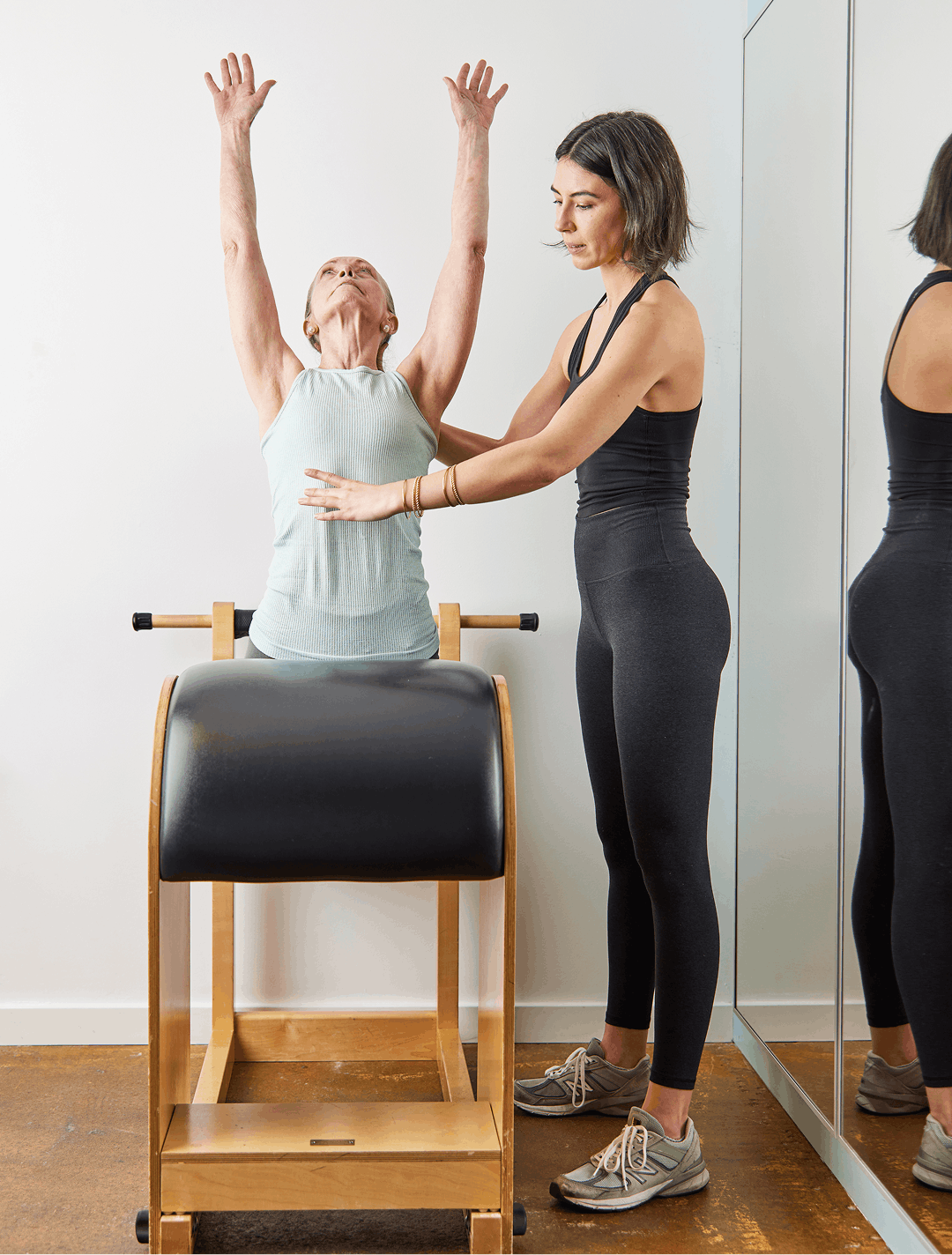 a woman in a pilates for back pain in seattle at union pilates