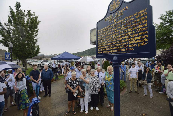 Eddie's family members (center) gather for the unveiling of the new marker. Photo by Dan Speicher, for The Tribune Review
