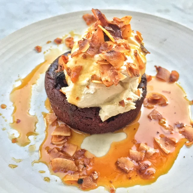 Fudge Brownie with Coconut Bacon, Caramel Sauce and Coconut Cashew Whipped Cream