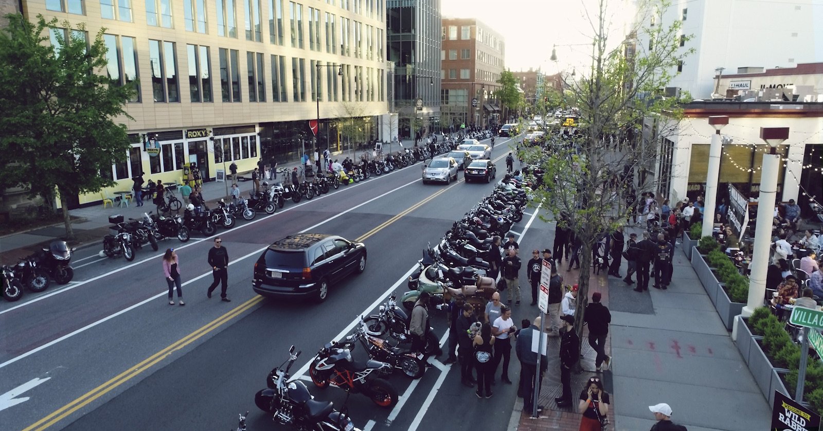 picture from the roof top looking down on mass ave, where bikers are hanging out