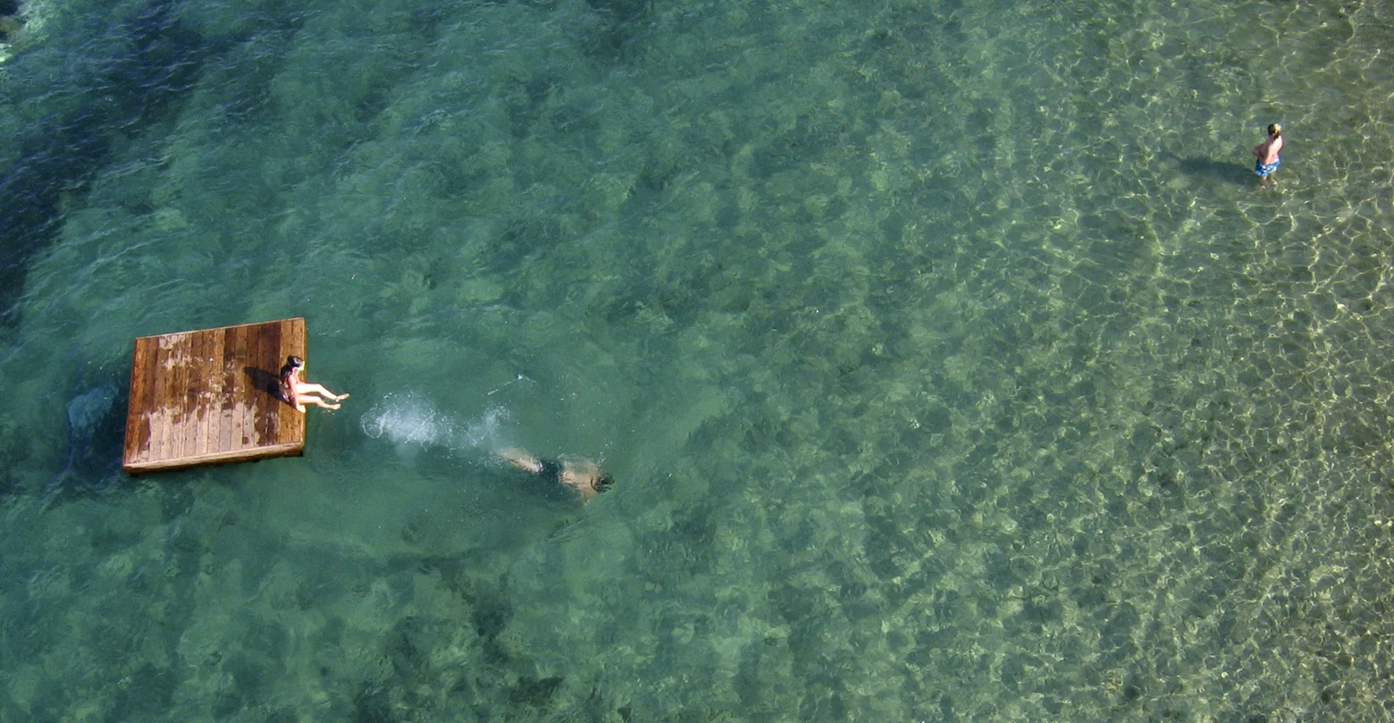 Diving into the silken waters of Lake Chelan. The three of us spent some delightful days at this lake in central Washington State. The water is just amazing! This image was taken with my camera suspended overhead on a kite-string.