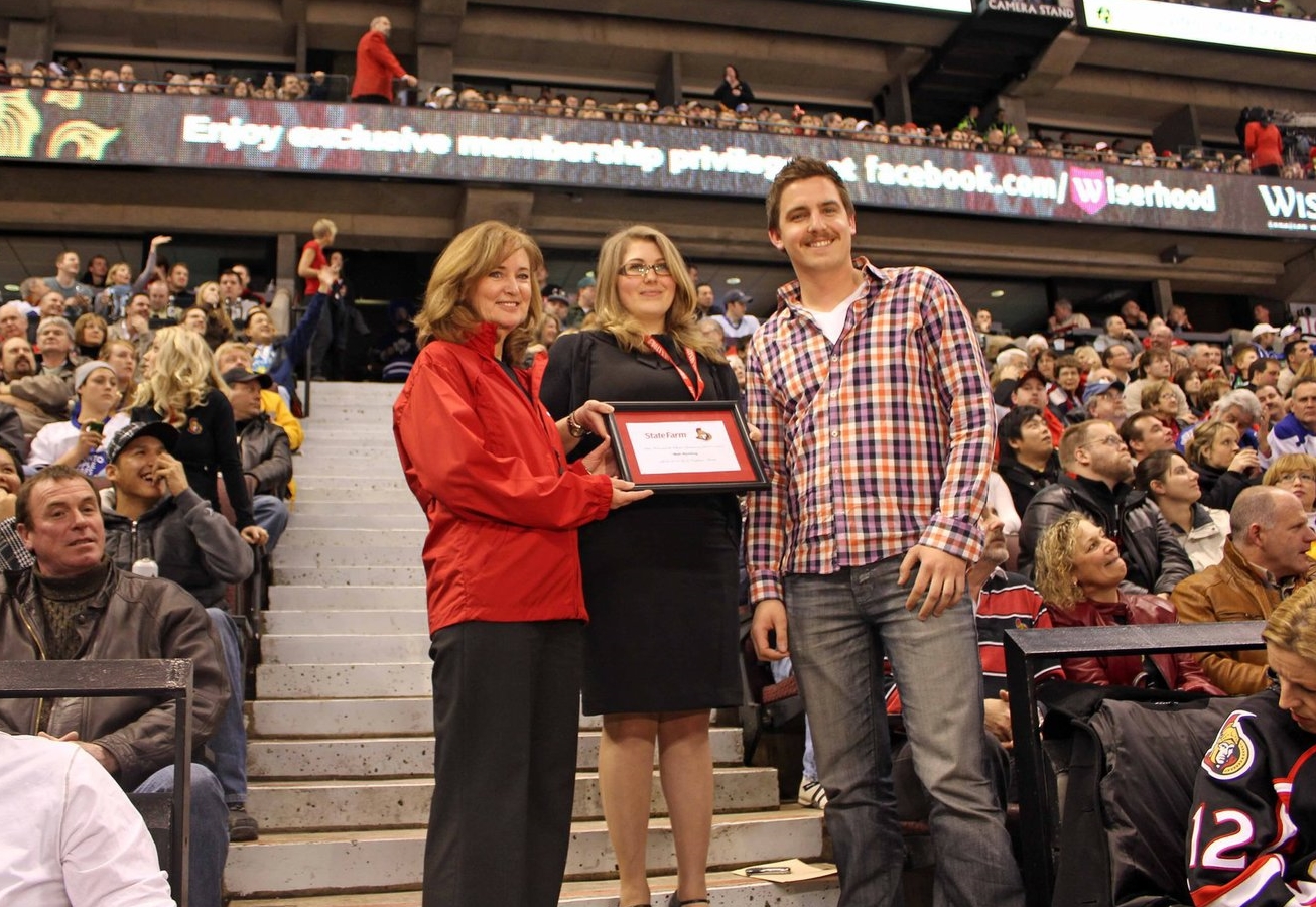 Matt receiving the Ottawa Senator Good Neighbour Award during a commercial break at an Ottawa Senators home game in 2010.