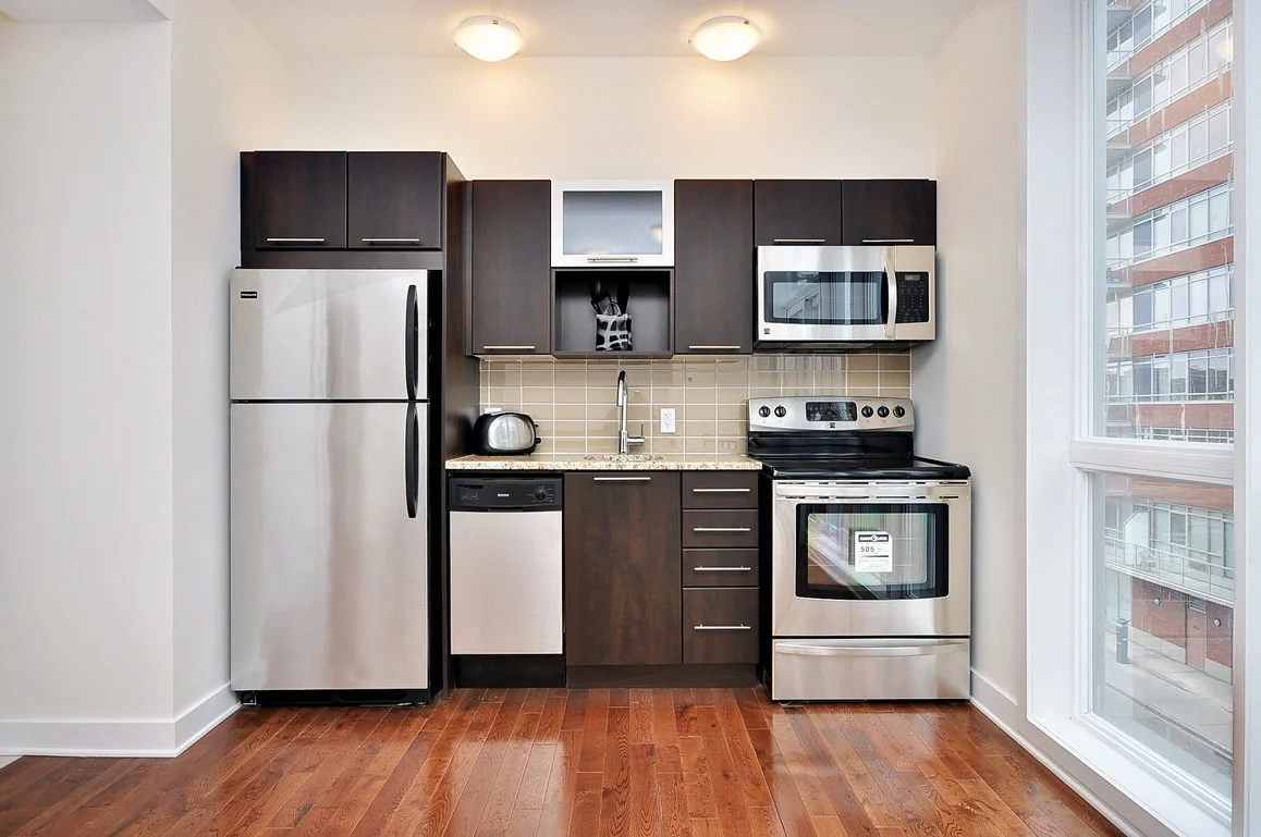 A kitchen inside a studio at 360 Lofts.
