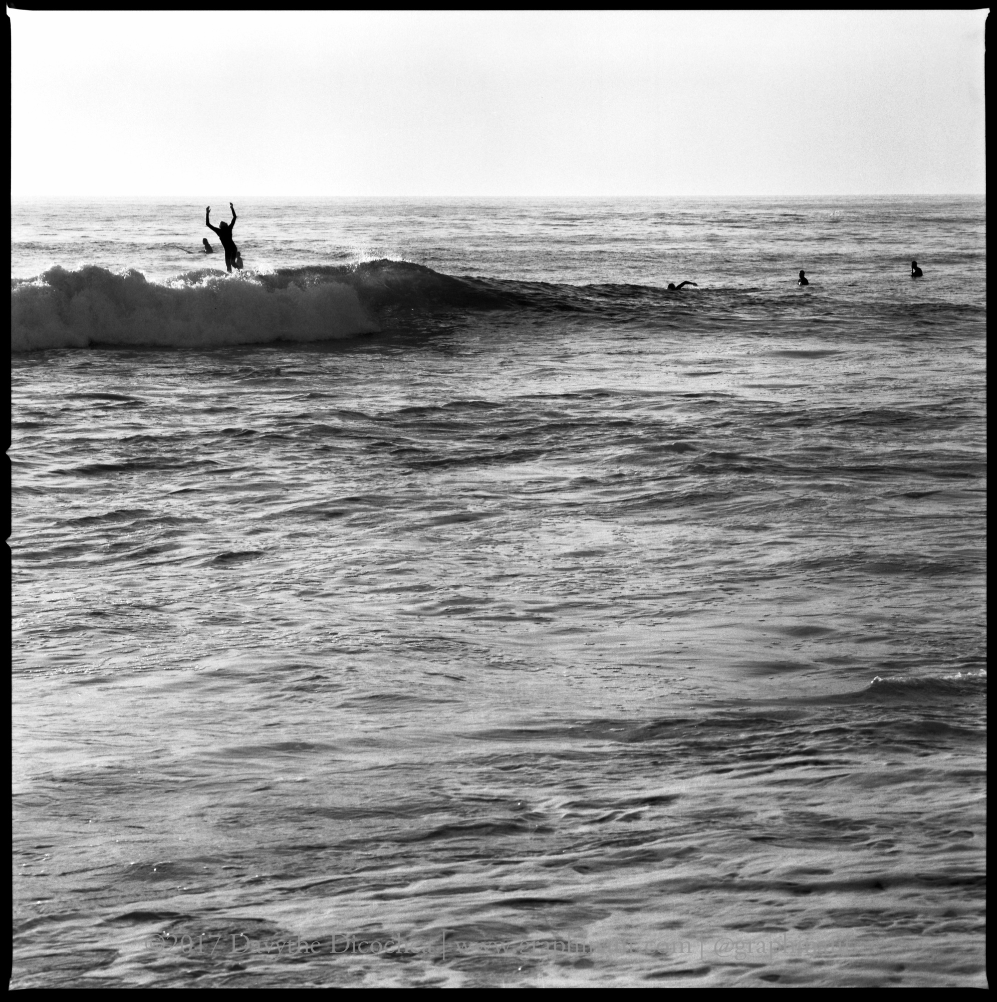 A Surfer Falling off his Board, California