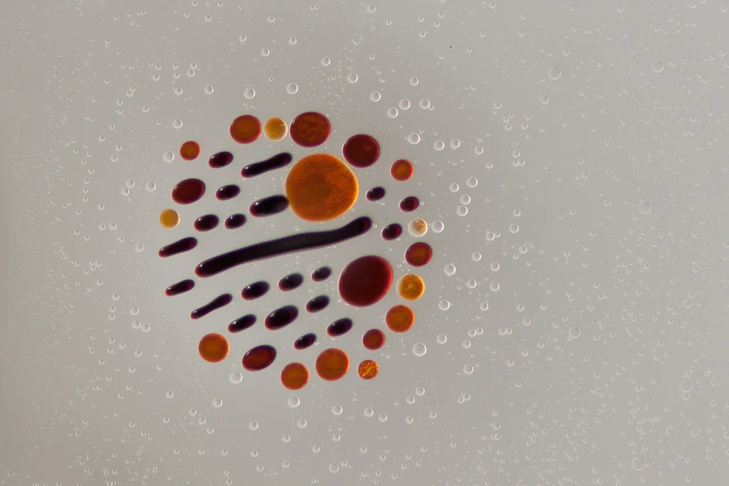 Ferrofluid forming complex shapes as it joins the main group