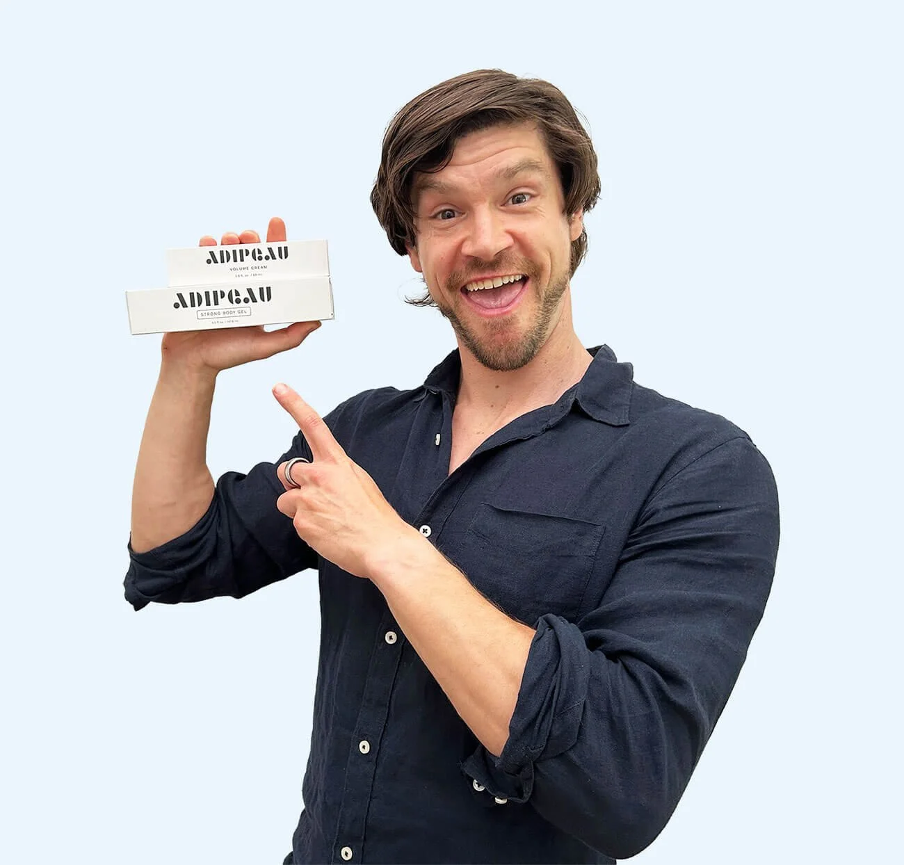 nick holding a tube of Adipeau Strong Body Gel skincare