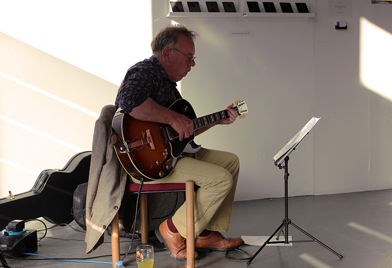 Keith Pell in a process of making the private view even more enjoyable