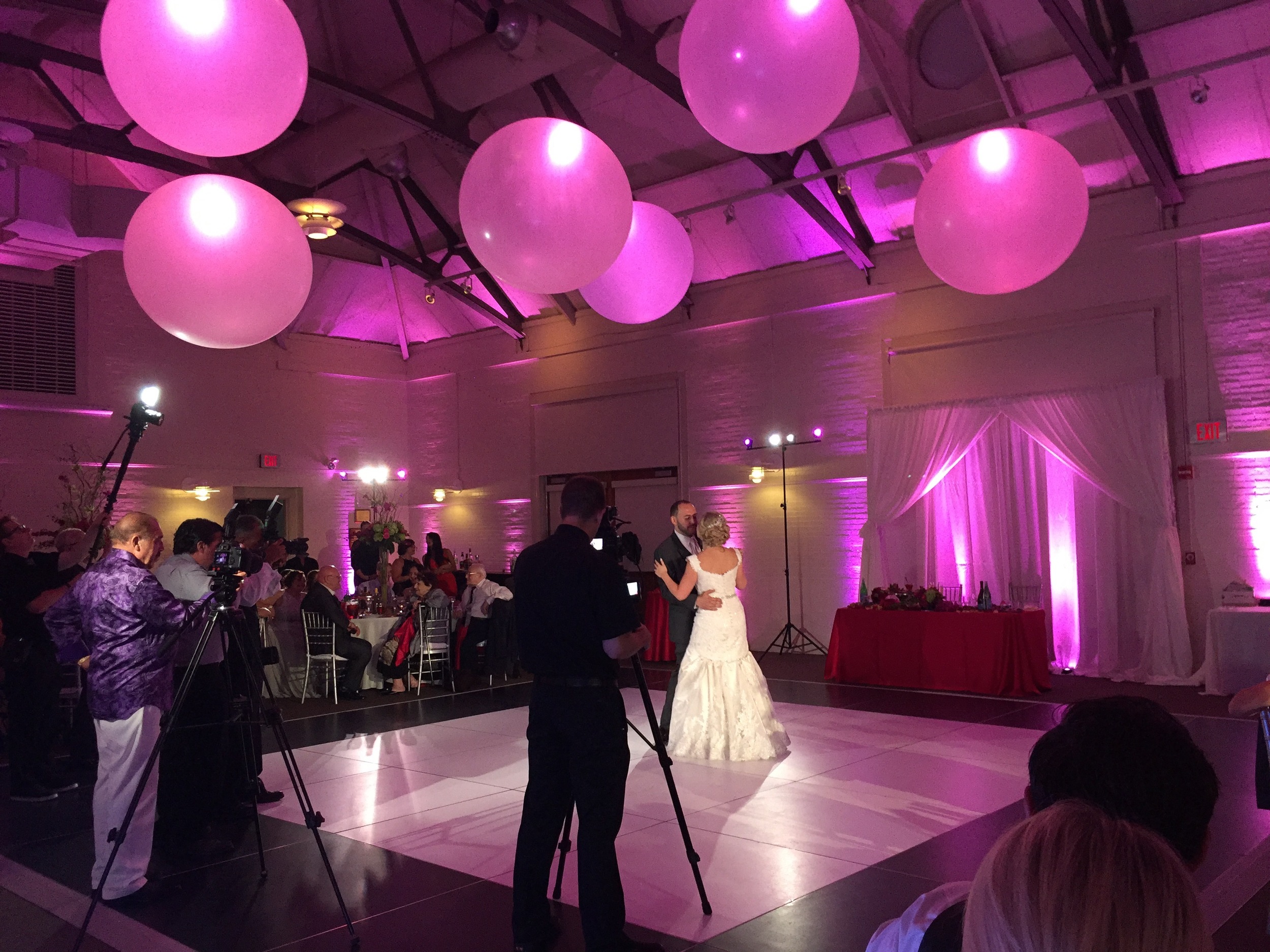 When Tatyana and Vadim took to the floor for their first dance, the room was transformed into a swirling dance of pink and white, and specially positioned spotlights rose on the dance floor, making them the stars of the show.
