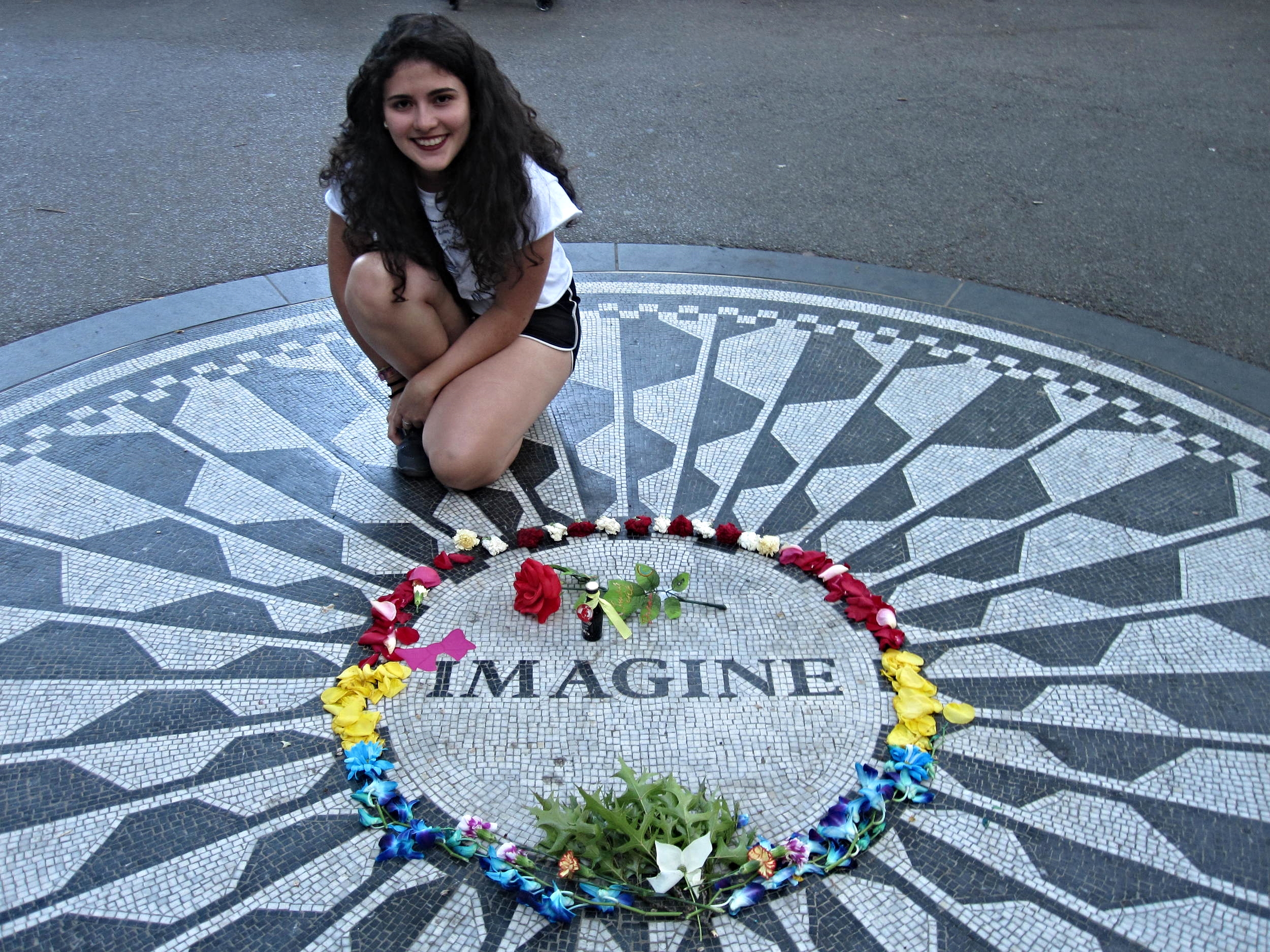 Andi posing for Pauline at the John Lennon Strawberry Fields Memorial in Central Park