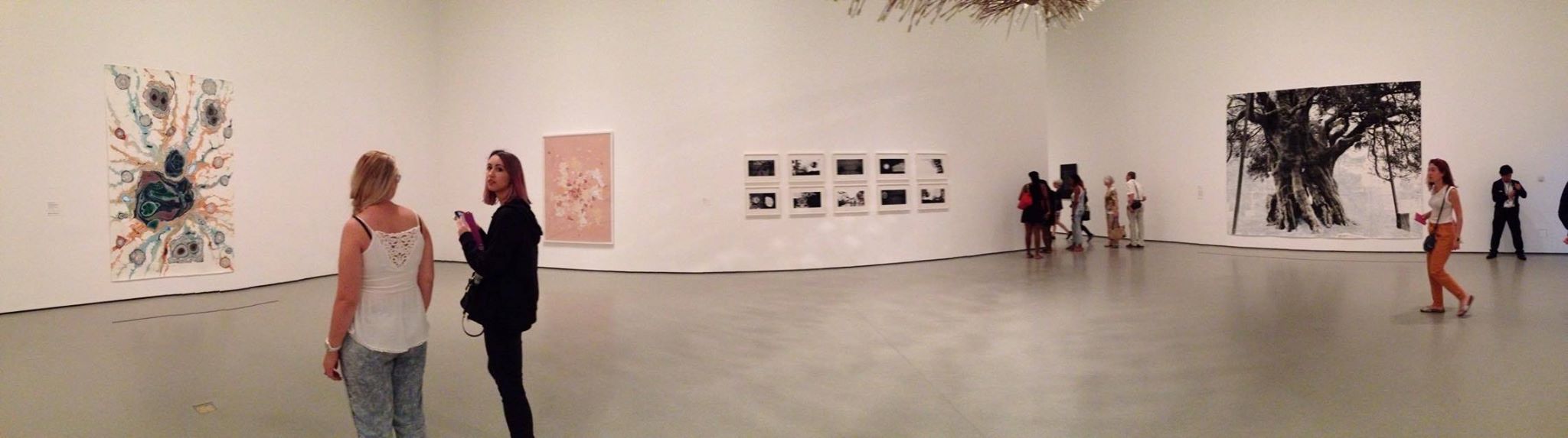 The surrounding art works in the room with Jessica's assigned Murakami piece-- Olivia and Michelle in the foreground in the left of the photograph.