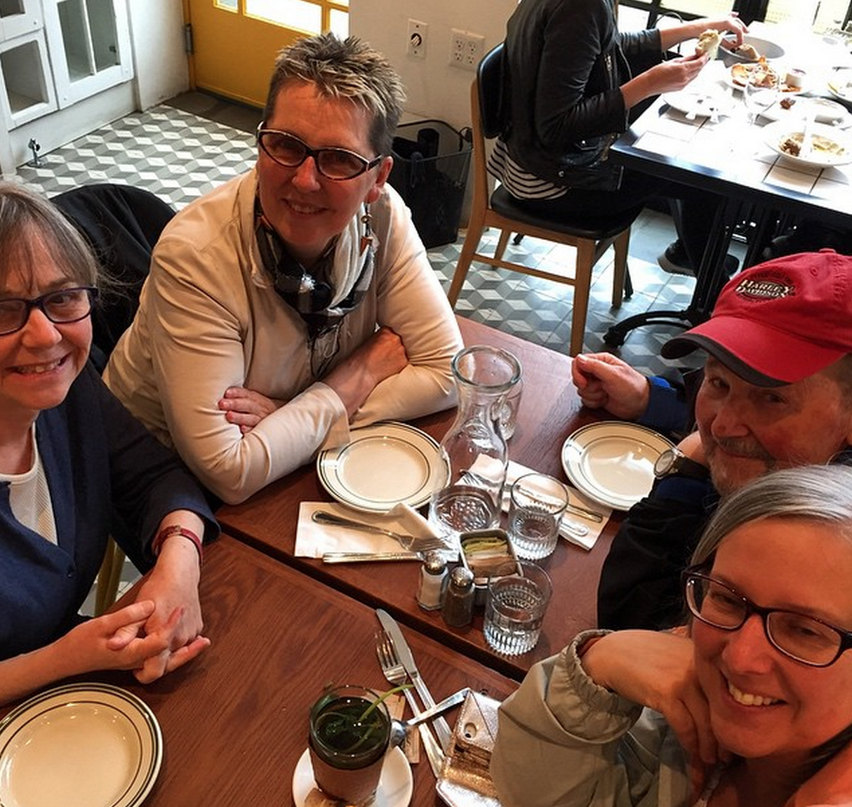 Larry (top right in photograph) enjoying lunch in Brooklyn with Margaret, Jude, and Angela.