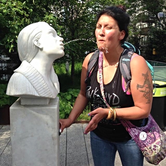 Roxanne enjoyed engaging with lots of the public art all over New York-- here she is with a sculpture immortalizing Bruce Nauman's Self-Portrait as Fountain , located on the Chelsea Highline.