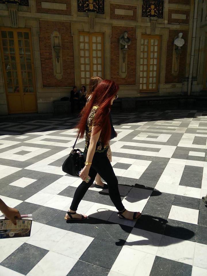 Kaila strolling through the courtyard at Versailles.