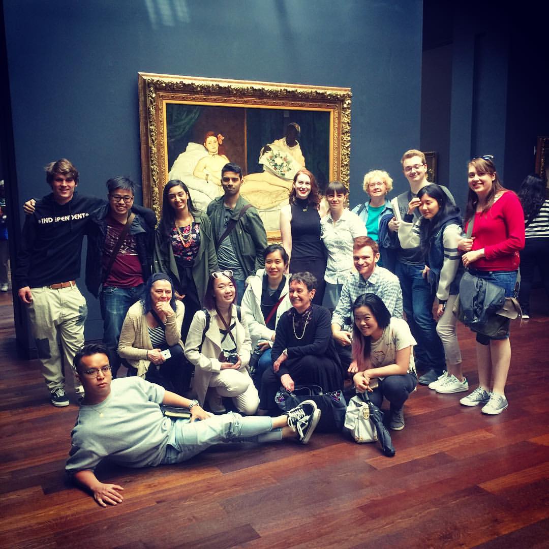Alice (center) and field school students pose in front of Manet's iconic Olympia (1863) at the Orsay Museum.