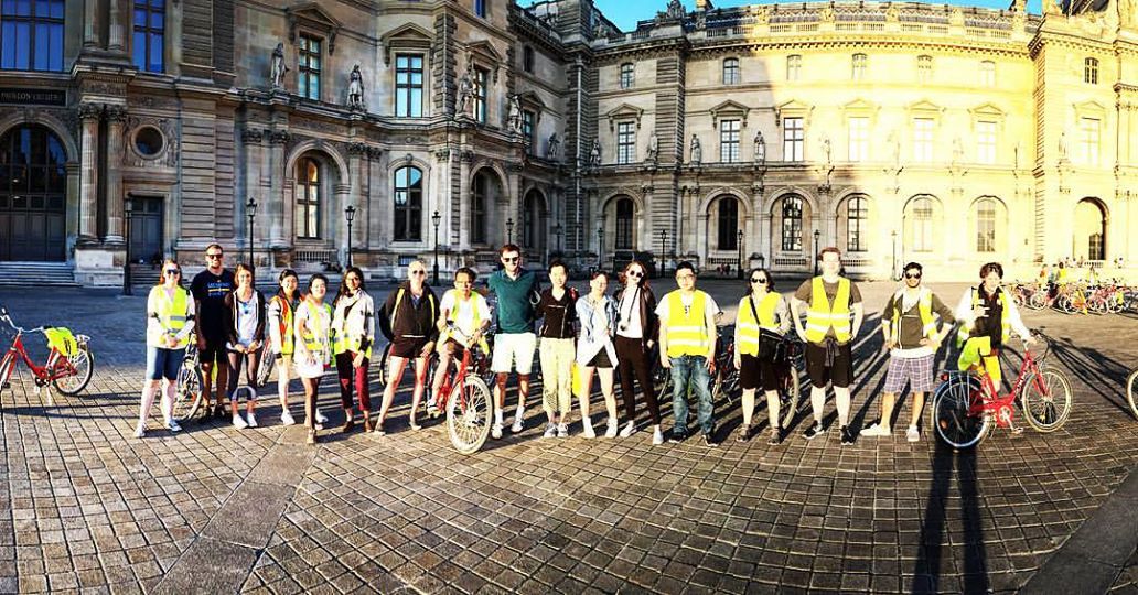Group photo by the Louvre Palace on the sunset bike tour. Zoe is fifth from the left. 