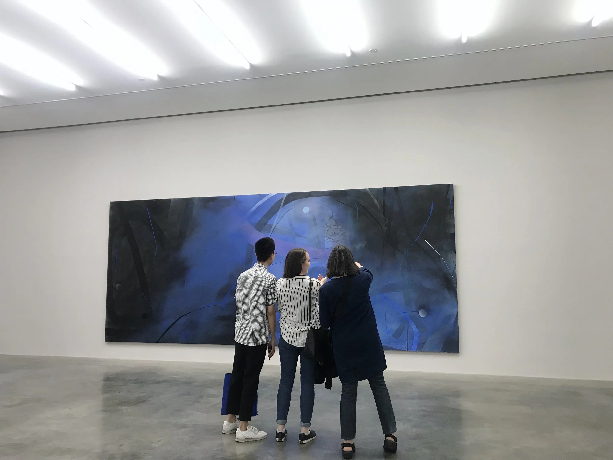 Ronald, Alison, and Elizabeth taking a closer look at a Zhou Li painting at the White Cube Gallery