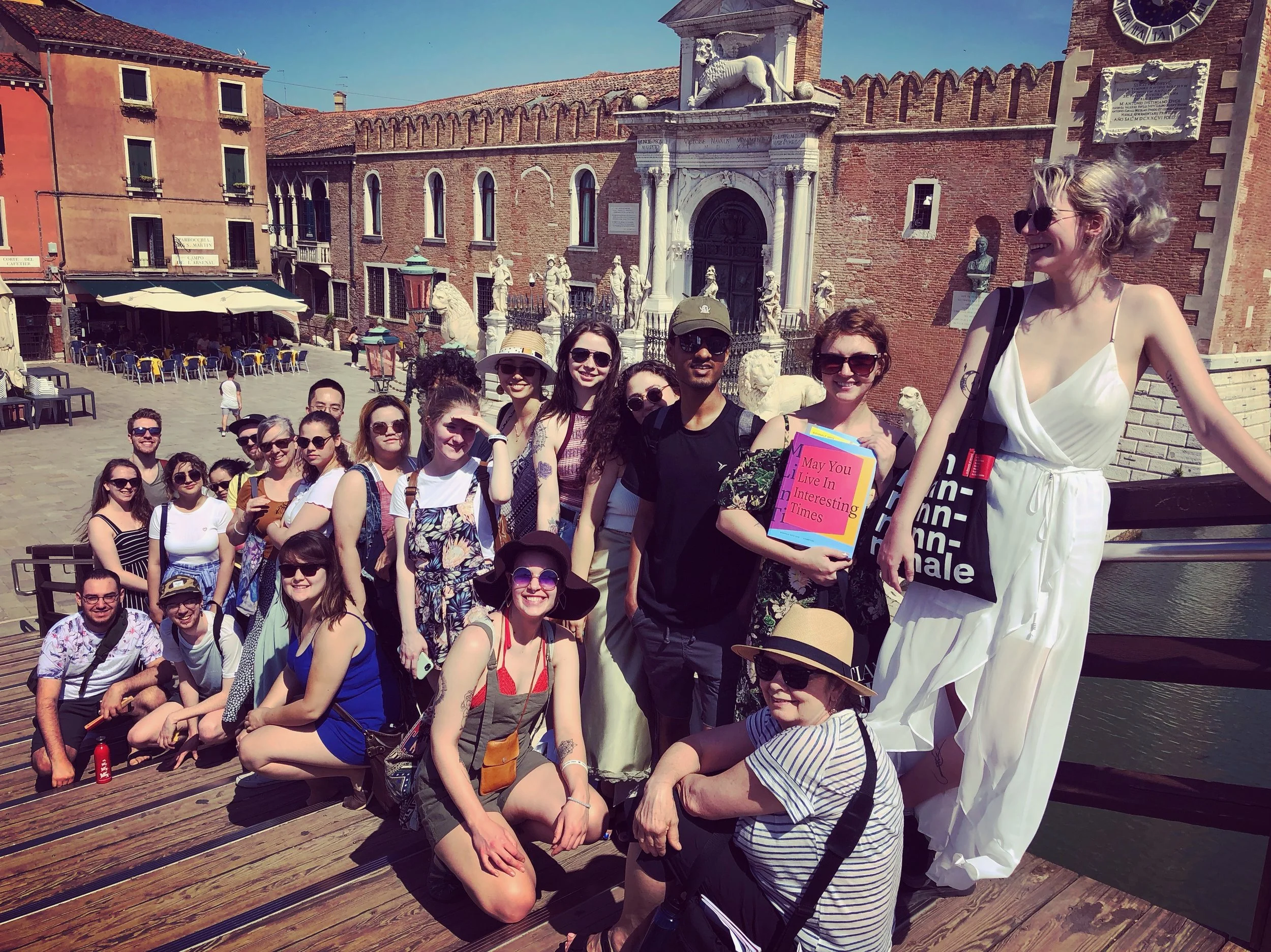 Leah (crouched in centre of photo) and the group outside the Venice Biennale Arsenale grounds.