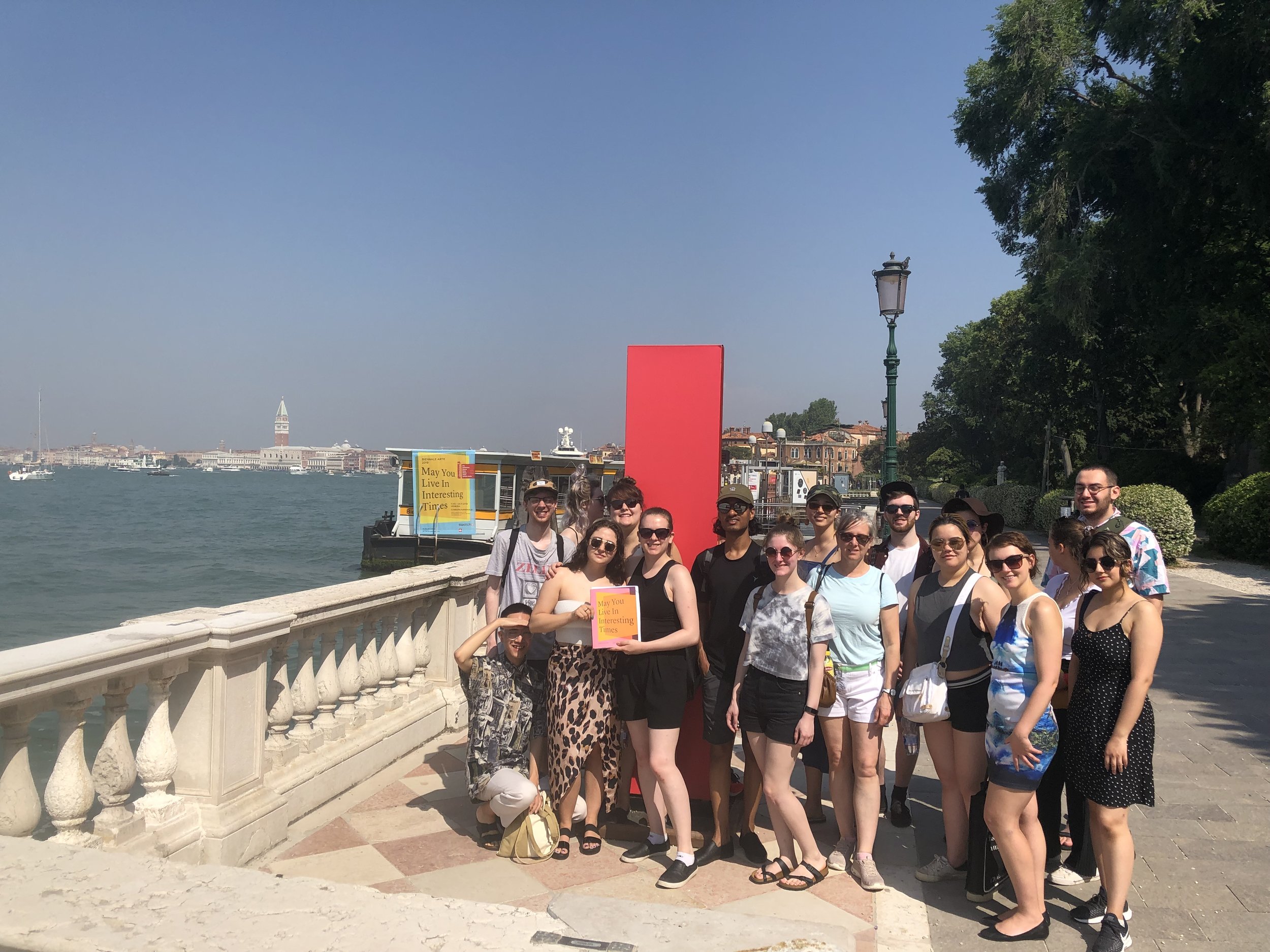 The group posing outside the Venice Biennale Giardini grounds (Allison is at center in the photo).