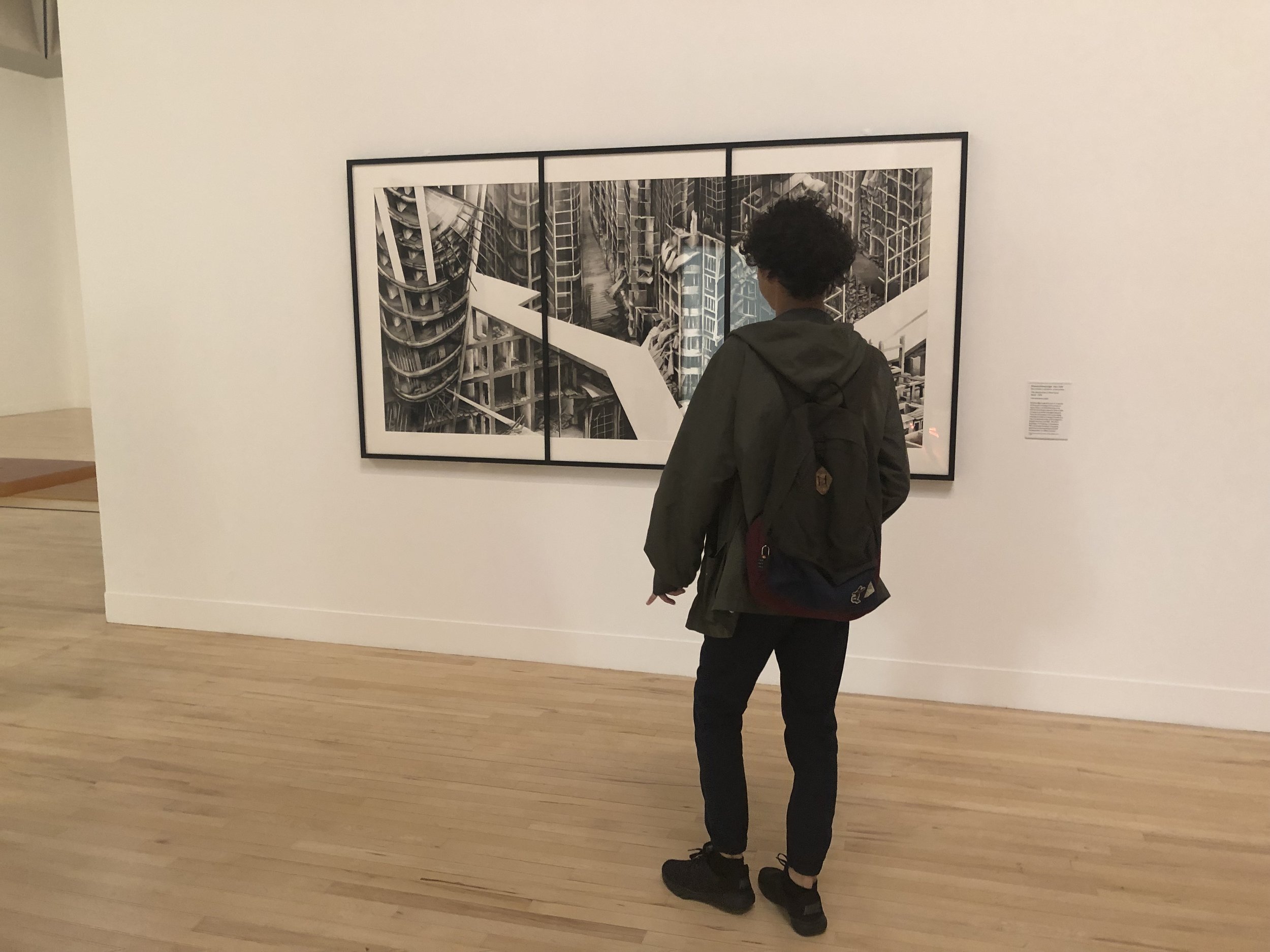 James seeing one of his assigned art works, Deanna Petherbridgeâs ink painting The Destruction of the City of Homs (2016), at the Tate Britain.