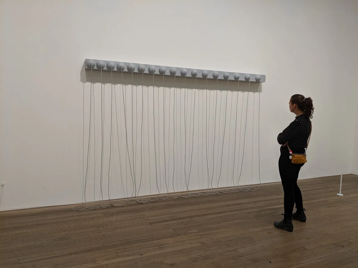 Amiee examining Eva Hesse’s Addendum (1967) at the Tate Modern