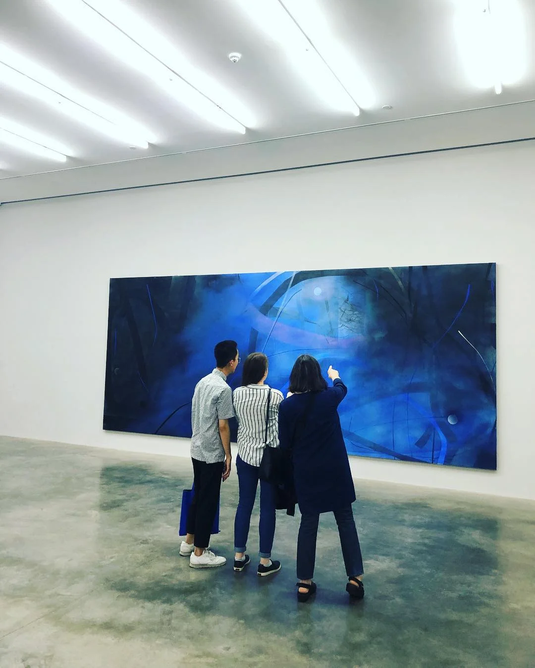 Elizabeth (right) with Ronald and Alison at White Cube art gallery in London viewing work by Zhou Li.