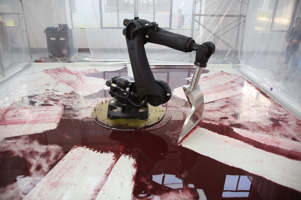 "‘Me Watching Y’all Cry Over a Robot Scooping Red Paint’ Bizarre Viral Hit on Social Media"