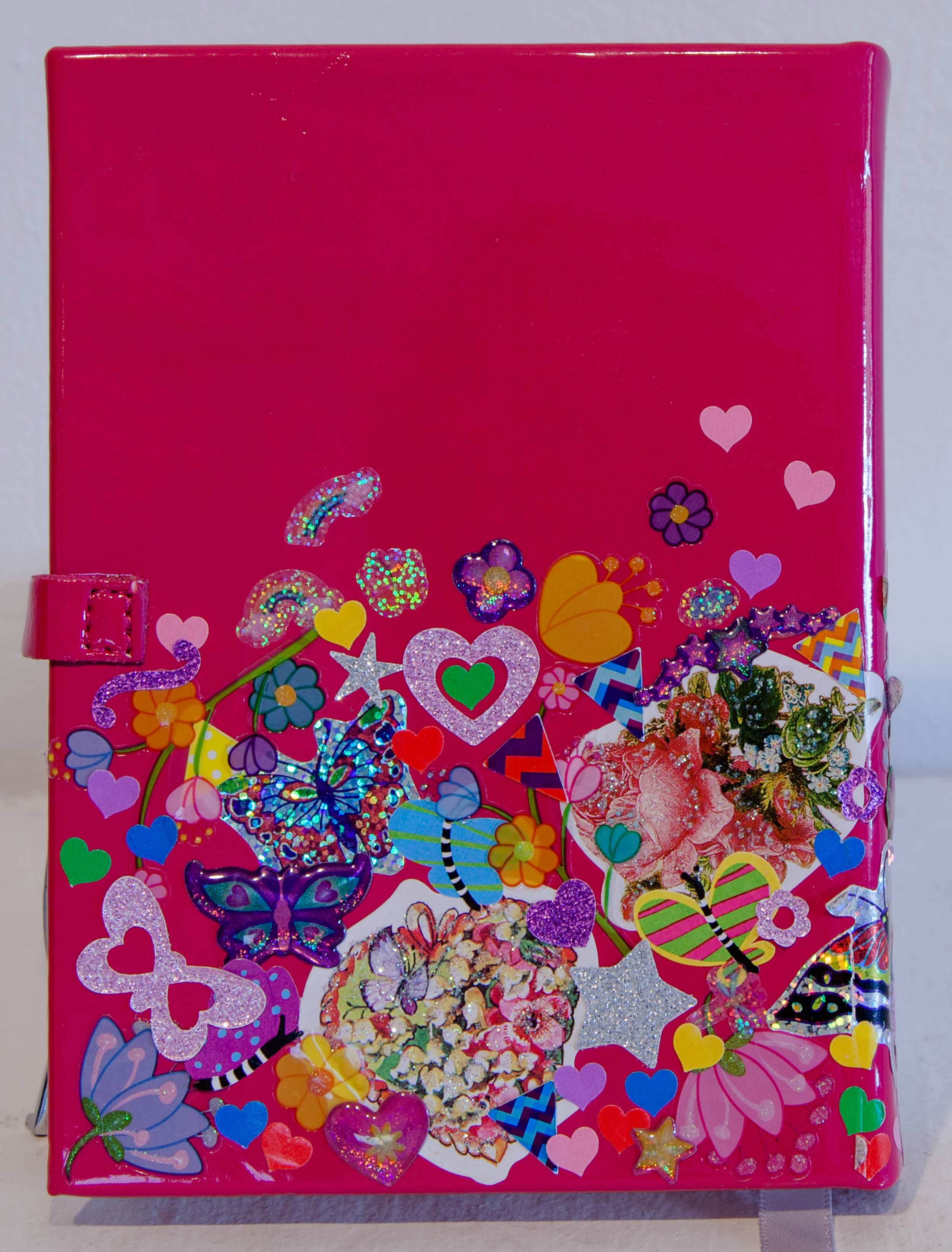    Felia (Diary, Back) ,  found patent leather pink diary, and sticker collage, 4" x 6" x 1", 2016 