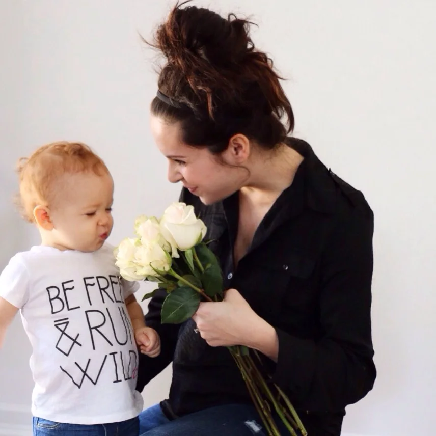 She loves flowers and I love her expression.
