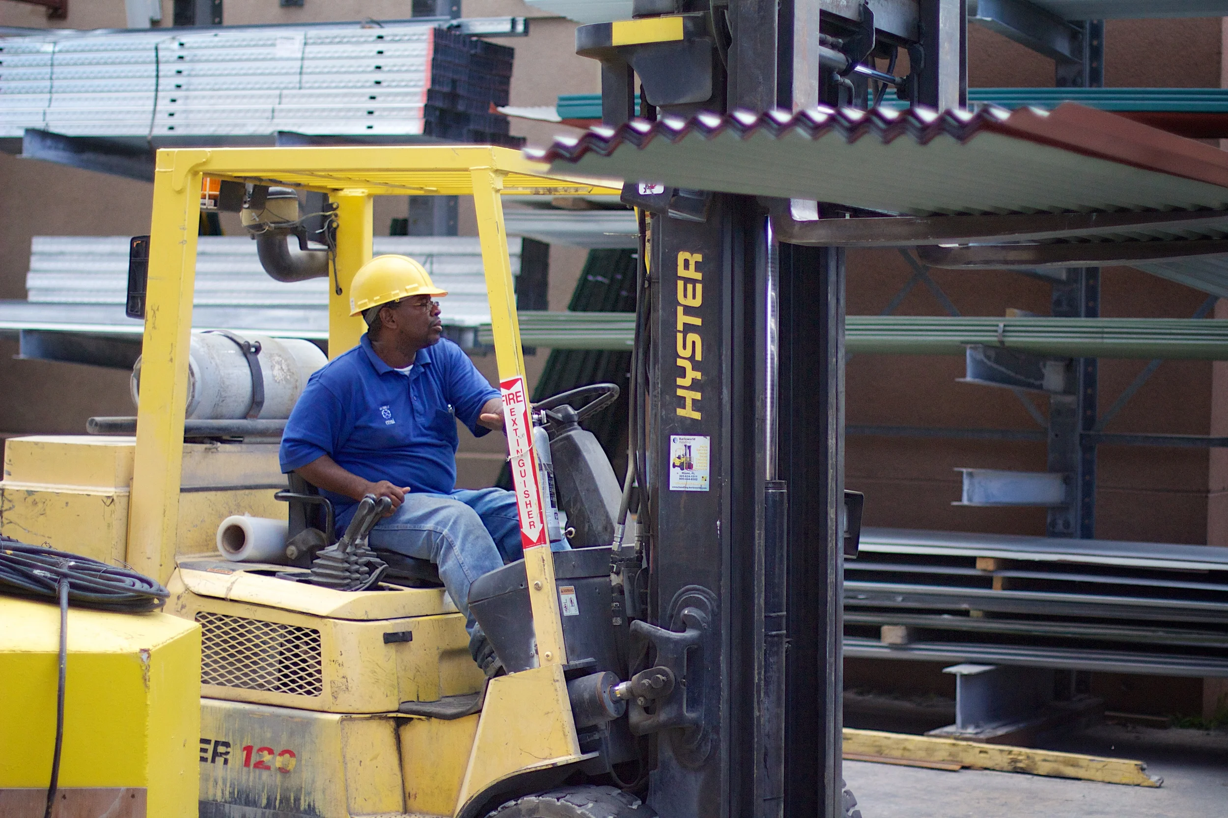 stock-photo-construction-worker-using-laptop-with-excavator-on-the-background-163005311.jpg