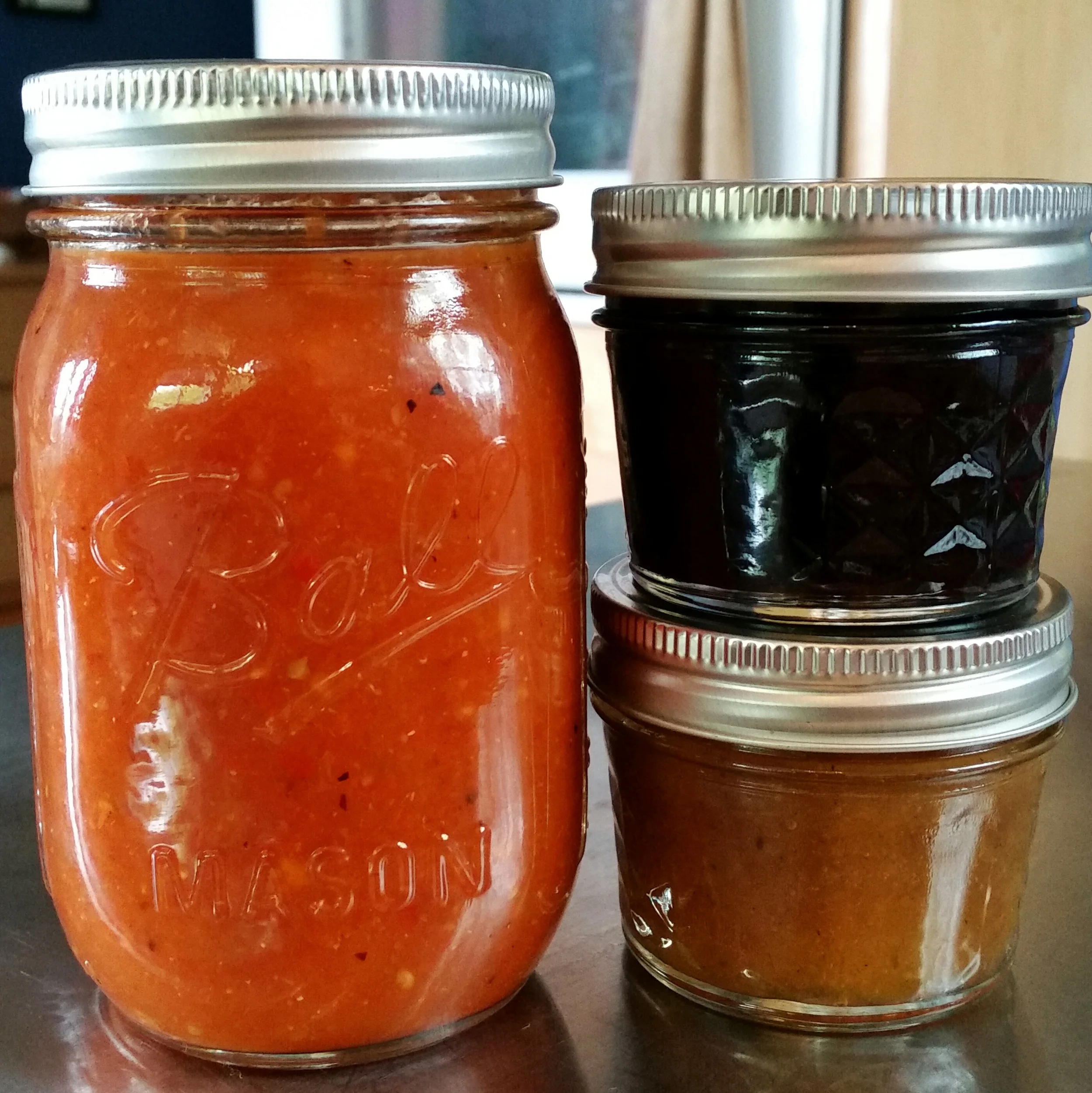 Left going clockwise: Roasted five-chile salsa, Blueberry Chamomile Lemon Compote, Honey-sweetened spiced peach butter with bourbon. Recipes for these goodies coming soon!