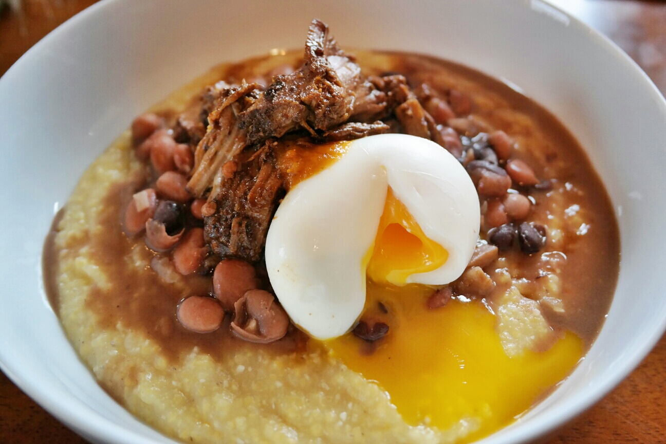 Braised Ancho Chile Pork with a Pinto and Black Bean Medley, Roasted Chile Salsa, Soft Egg, and Savory Grits