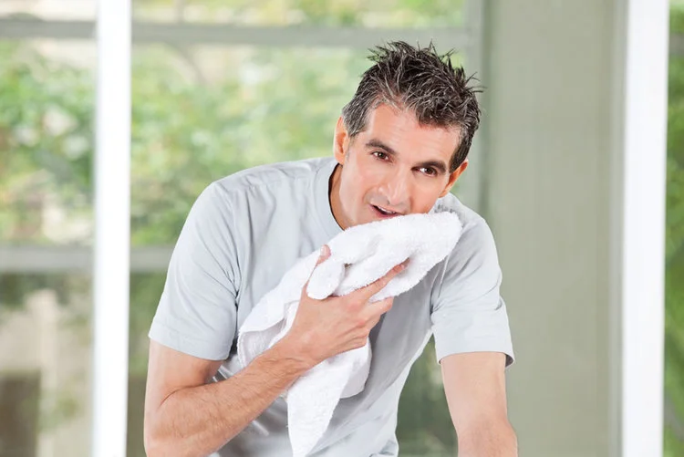 Man rests while listening to his Cardio Workout