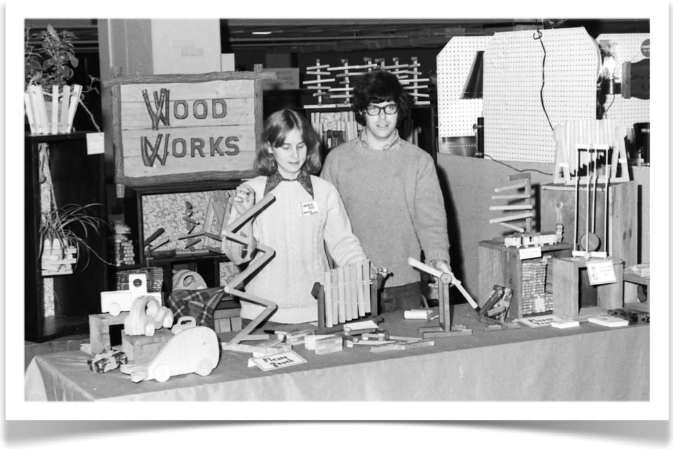 Showing the toys at a Hartford Civic Center craft fair (c 1975)