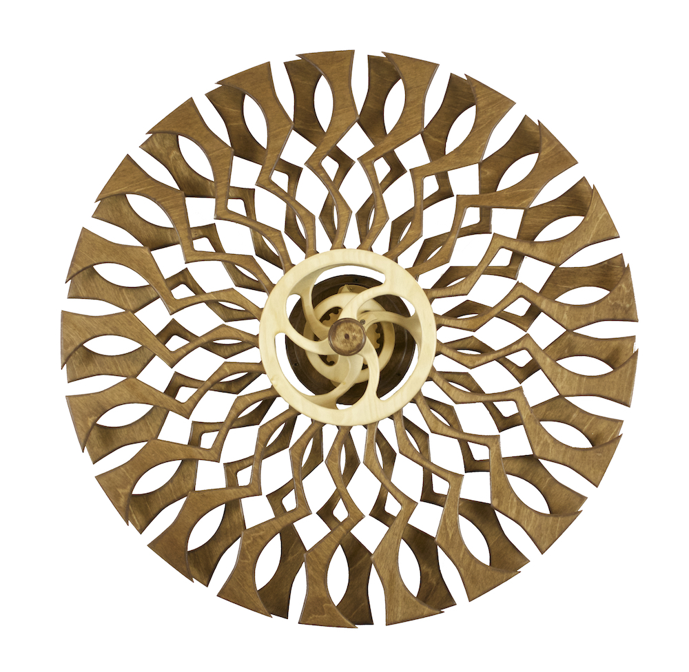 Kindala - Shadow is a spring-driven kinetic wall sculpture designed by David C. Roy of Wood That Works in 2016.